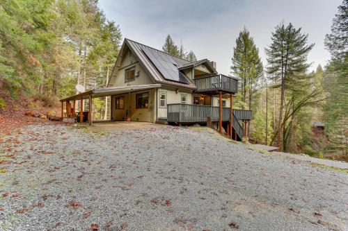 a house on a hill in the woods at Private Cabin with Forest Views and Grill in Lakehead! in Lakehead