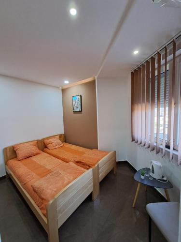 a bedroom with a large bed in a room at Lena lux in Jagodina