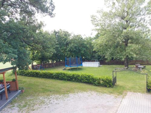 a park with a playground with a play equipment at Casa Campomonte in Poppi
