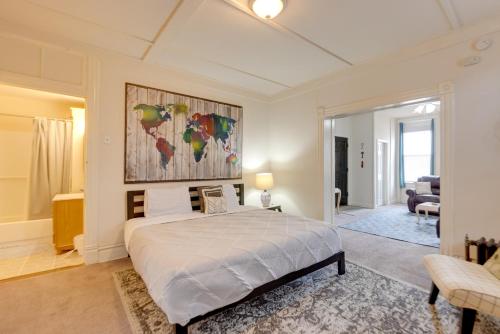 a bedroom with a bed and a painting on the wall at 9 Mi to Downtown St Louis Apt with Fire Pit Access in Bella Villa