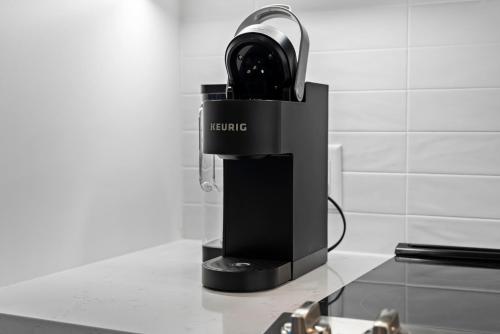 a blender sitting on top of a counter at Luxury Furnished Apartment Near Logan Airport in Boston
