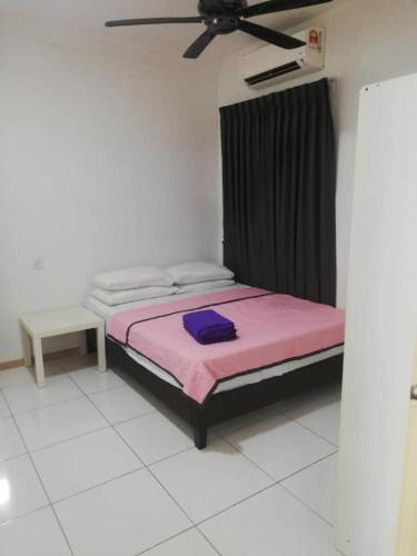 a bedroom with a bed and a ceiling fan at Vista Alam 3 bedroom in Shah Alam