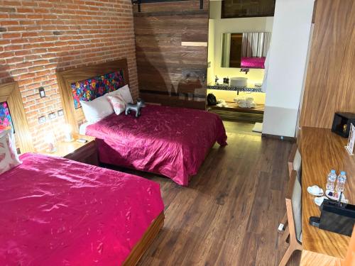 Ένα ή περισσότερα κρεβάτια σε δωμάτιο στο Hotel Casa Chanehque
