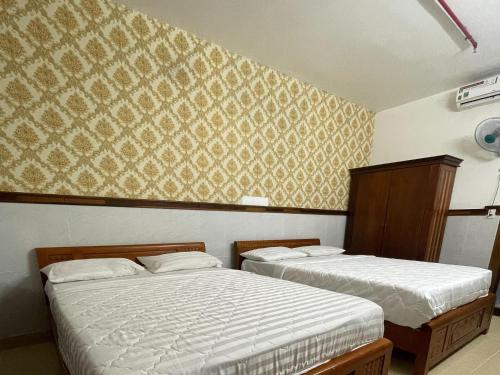 Giường trong phòng chung tại Thien Tan Hotel