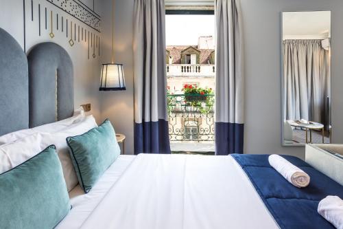 a bedroom with a large bed and a window at The Lift Boutique Hotel by RIDAN Hotels in Lisbon