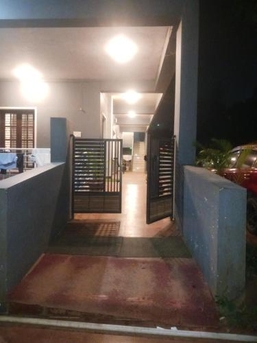 a stairway leading to a house at night at Coorg Sunway home stay in Madikeri