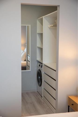 Ένα ή περισσότερα κρεβάτια σε δωμάτιο στο Golden Lake apartman