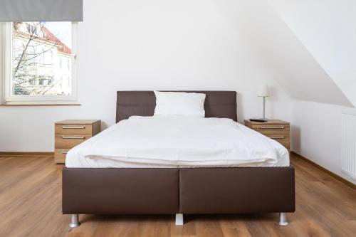 Ένα ή περισσότερα κρεβάτια σε δωμάτιο στο Ferienwohnung Lohstraße - in TA Bildungszentrum und Bahnhofsnähe