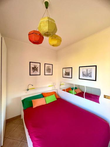 a bedroom with a bed with a red blanket at Vacanze Romane LB&C in Rome