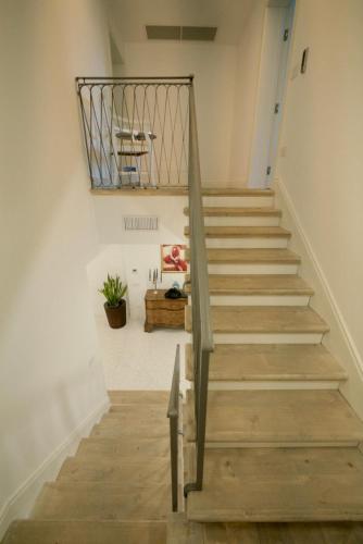 a staircase in a room with wooden floors at Affittacamere Ca' Cini in Monselice