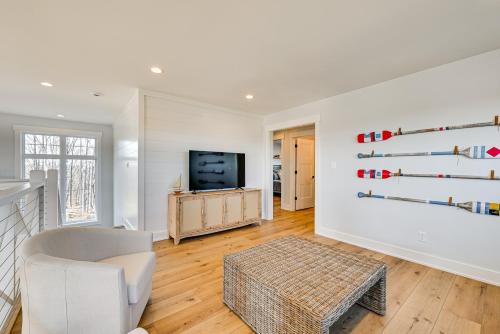 a living room with a couch and a tv at Lakeside Home Near Mammoth Cave and Nolin Lake! in Cub Run
