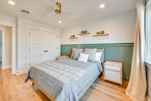 a bedroom with a bed and a green wall at Lakeside Home Near Mammoth Cave and Nolin Lake! in Cub Run