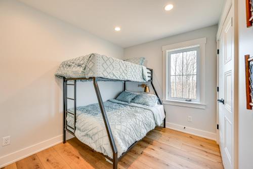 a bedroom with a bunk bed and a window at Lakeside Home Near Mammoth Cave and Nolin Lake! in Cub Run