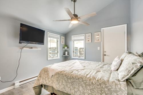 a bedroom with a bed and a flat screen tv at Renovated Ocean City Retreat - Walk to Beach! in Ocean City