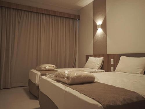 Ένα ή περισσότερα κρεβάτια σε δωμάτιο στο Praias do Lago