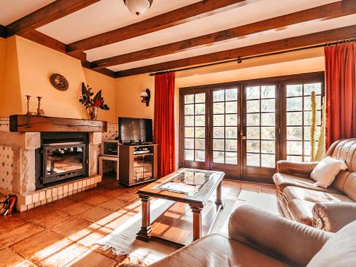 a living room with a couch and a fireplace at Oliveira's House By Gt House in Sintra