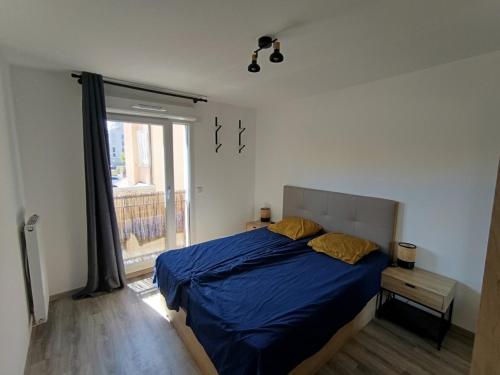 En eller flere senge i et værelse på Apartment in Ville-la-Grand