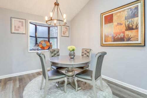 a dining room with a table and chairs at Lithonia Home, 5 Mi to Panola Mountain State Park in Lithonia