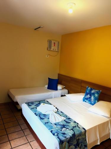Katil atau katil-katil dalam bilik di Hotel Ponta das Toninhas