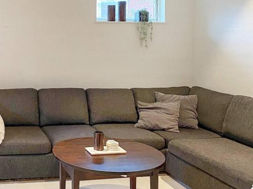 a living room with a couch and a table at 3 person holiday home in UDDEVALLA-By Traum in Uddevalla