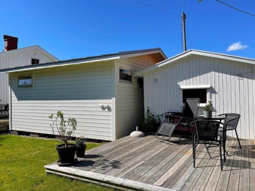 a patio with a table and chairs on a deck at 3 person holiday home in UDDEVALLA-By Traum in Uddevalla