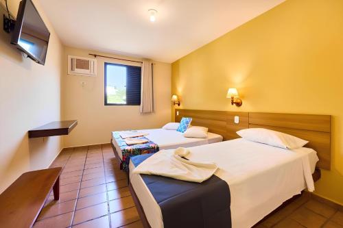 Katil atau katil-katil dalam bilik di Hotel Ponta das Toninhas