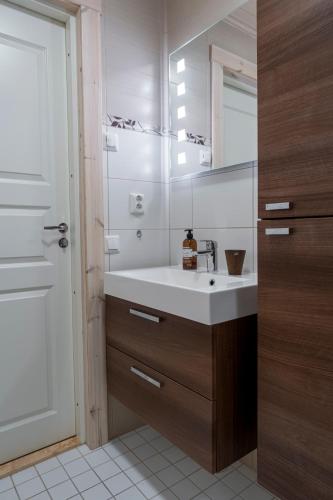 a bathroom with a sink and a mirror at Villa Aurora in Jaala