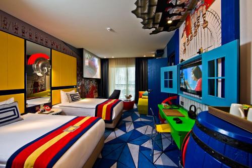 a hotel room with two beds and a tv at The Land Of Legends Kingdom Hotel - All-in Concept in Belek