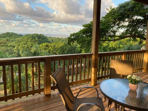 a table and chairs on a deck with a view at Apartment Diamond Hill Resort in Diamond Rock