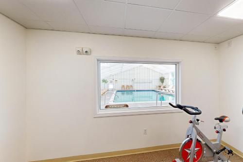 a room with a bike parked next to a window at 204 Studio at Rivergreen in Lincoln