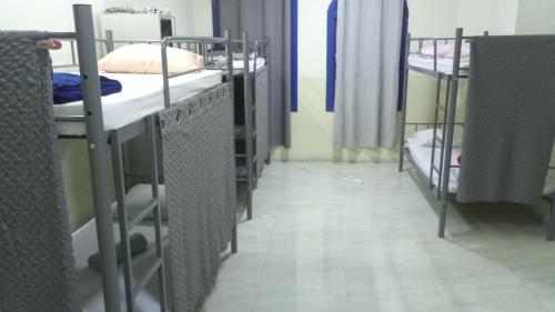 a row of bunk beds in a dorm room at SALEM House Hostel Nizwa in Nizwa