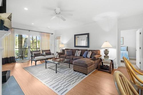 a living room with a couch and a table at Pawleys Plantation Retreat Villa Deluxe Amenities in Pawleys Island