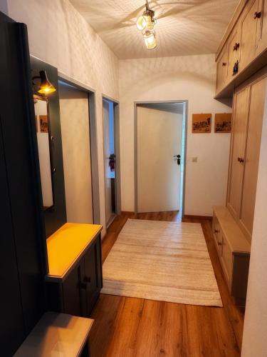 an empty room with a hallway with a door at Koralm Appartement 7 in Wolfsberg