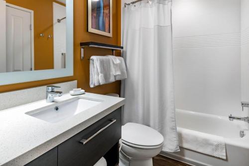 a bathroom with a sink and a toilet and a shower at TownePlace by Marriott Suites Gallup in Gallup