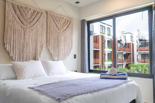 Ένα ή περισσότερα κρεβάτια σε δωμάτιο στο Pool & Rooftop in Tulum 2 Bedrooms Apartment