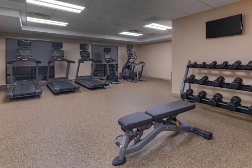 a gym with several treadmills and exercise machines at TownePlace by Marriott Suites Gallup in Gallup