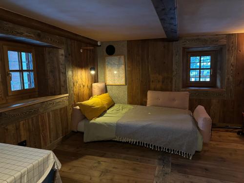 Postel nebo postele na pokoji v ubytování Casalpina Cozy chalet