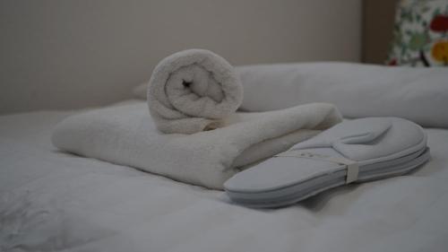 a towel on a bed with a towel at House of AlAy in Künzelsau