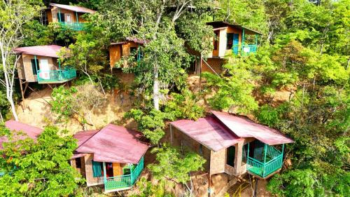 an overhead view of a group of houses on a hill at Refugio Ecolodge Shapingo in Moyobamba
