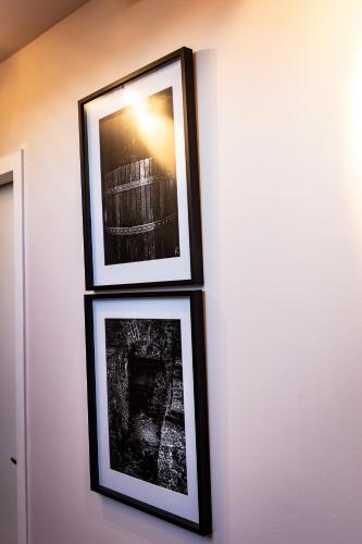 three framed photographs are hanging on a wall at Hôtel restaurant La Grand Mare in Conches-en-Ouche