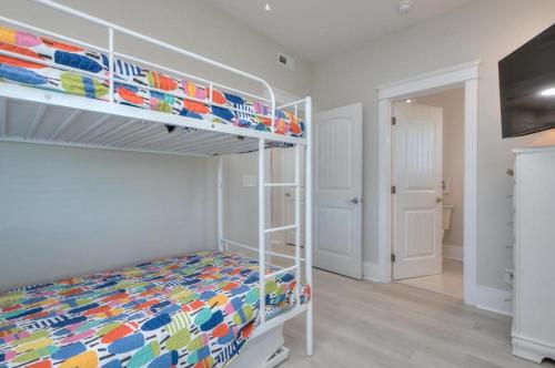 a bedroom with a bunk bed in a room at Aloweha in Oak Island