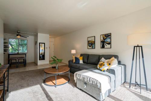 a living room with a couch and a table at Modern Condo - Get to Old Town in Minutes! in Scottsdale
