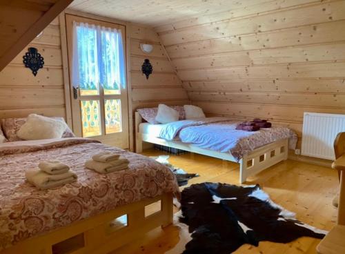 En eller flere senge i et værelse på CypiSówka