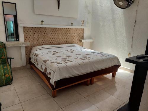 Una cama o camas en una habitación de Casa Esperanza