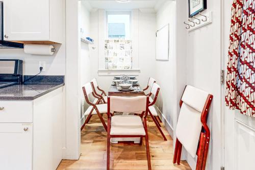 a small kitchen with a table and chairs at Mariner's Rest East in Anacortes