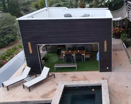 an overhead view of a patio with chairs and a pool at One-of-a-Kind MAUI Getaway! in Wailea