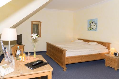 Cama o camas de una habitación en Hotel und Landgasthof Zum Bockshahn