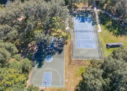 an aerial view of a tennis court in a yard at Cozy home near MCO in Kissimmee