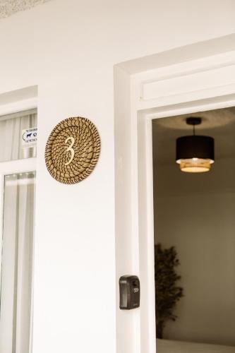 a door entrance to a home with a chandelier at Hotel VillaFlores in Quesada