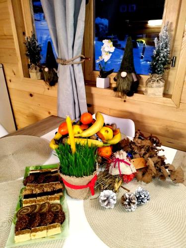 a table with a bunch of different types of food at Dedin Konak in Mokra Gora